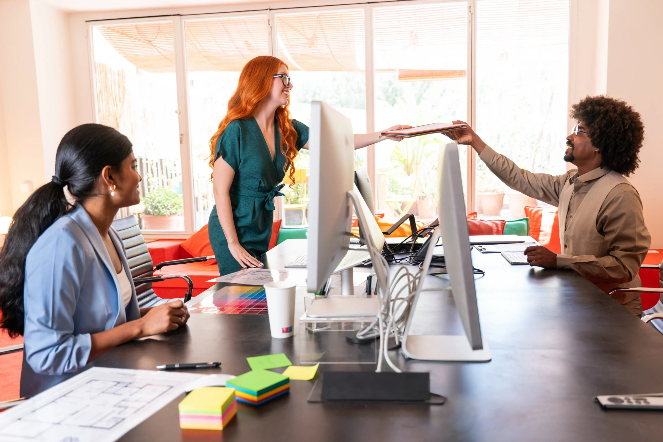 Team of diverse professionals collaborating in a bright modern office during a creative meeting, digital marketing agency in philadelphia